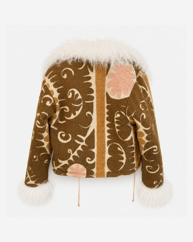 Martina Afghan Jacket No. 11, back view, in mustard brown with an embroidered swirl and sun motif pattern in cream and pink, and a cream shearling collar and cuffs.