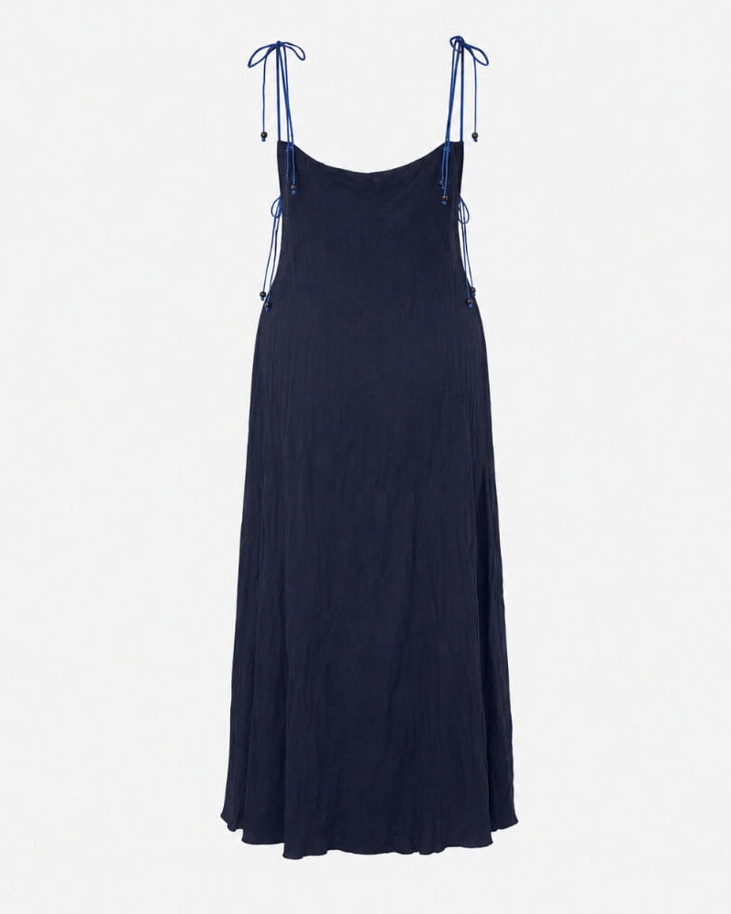 Back view of the Rose Dress in navy, strap version with tie-shoulder straps.