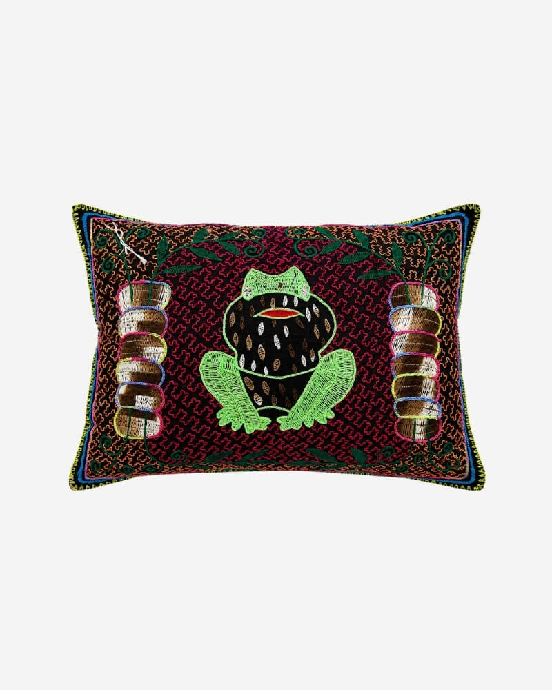 Hand-Embroidered Shipibo Cushion No. 14 in burgundy, with a large green frog motif at its centre and embroidered leaf border.