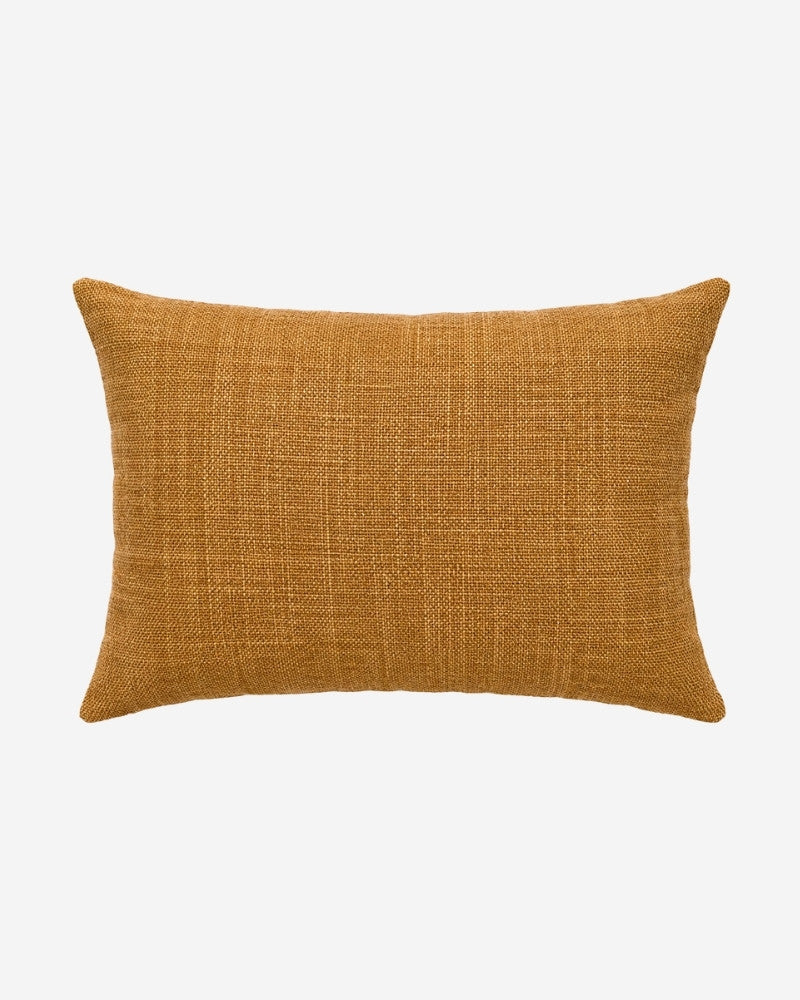 Hand-Embroidered Shipibo Cushion No. 12 by Lunaré – back view, solid mustard textured cotton cover.