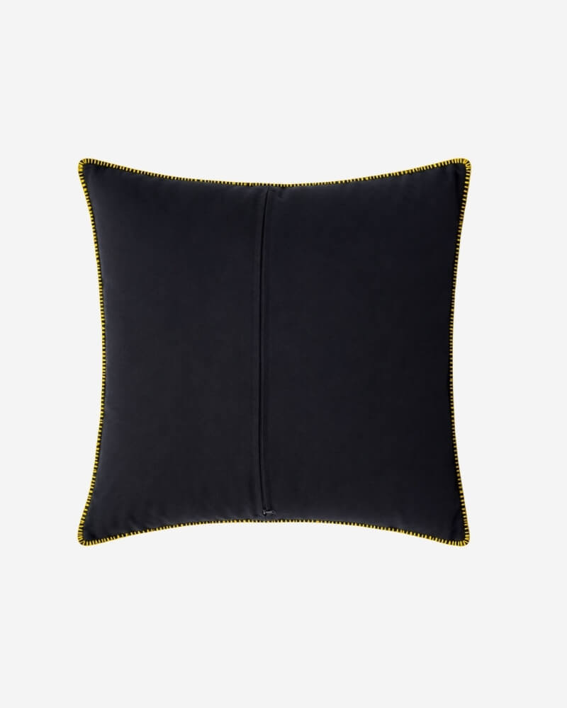 Hand-Embroidered Shipibo Cushion No. 8 by Lunaré – back view, solid black cotton cover with yellow contrast piping.
