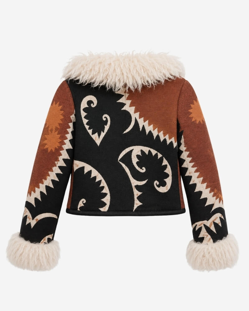 The Afghan Coat Coco No. 1 by Lunaré – back view showing the bold black, rust and cream leaf and sunburst pattern with cream shaggy lambskin collar and cuffs.