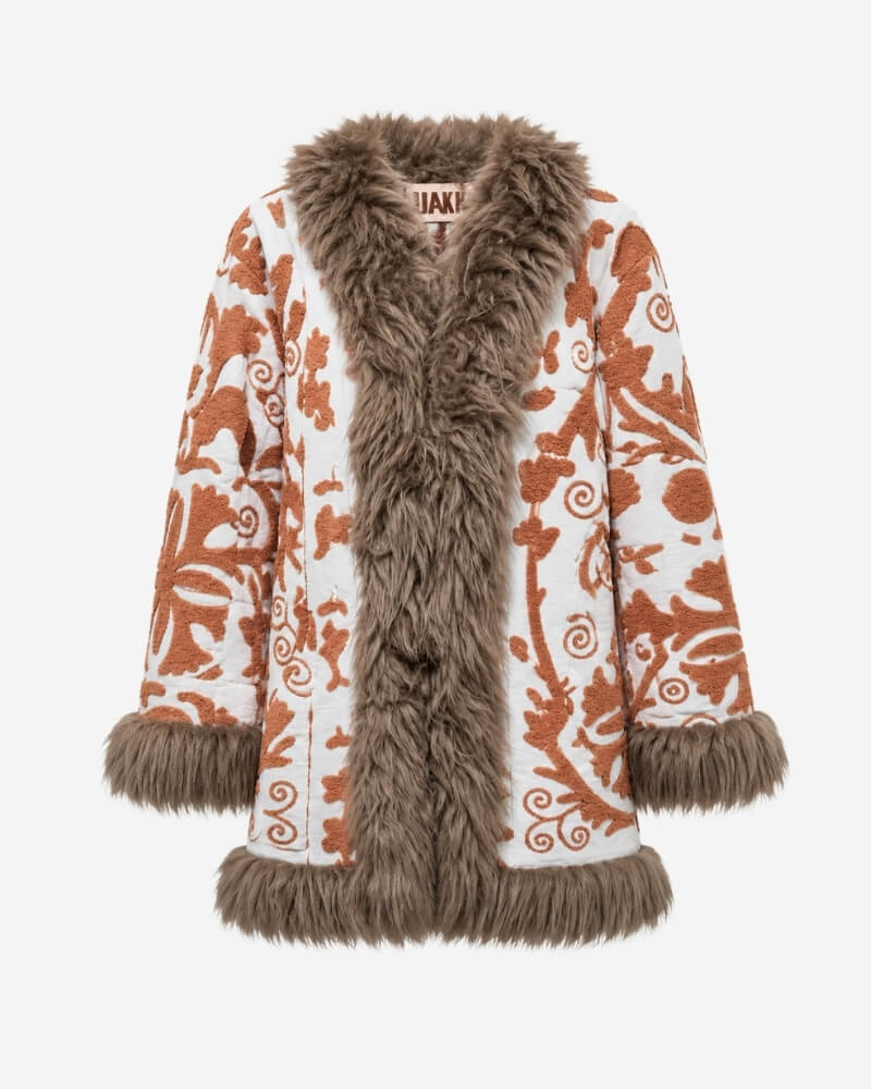 The Afghan Coat Jasmia No. 1 by Lunaré – front view, cream coat with rust hand-embroidered floral swirl pattern and taupe shaggy shearling trim throughout.