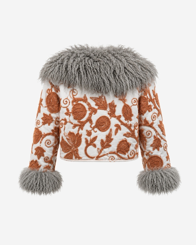 The Afghan Coat Martina No. 4 by Lunaré – back view with an allover hand-embroidered rust-orange vine and floral pattern and a light grey Tibetan lamb fur collar.