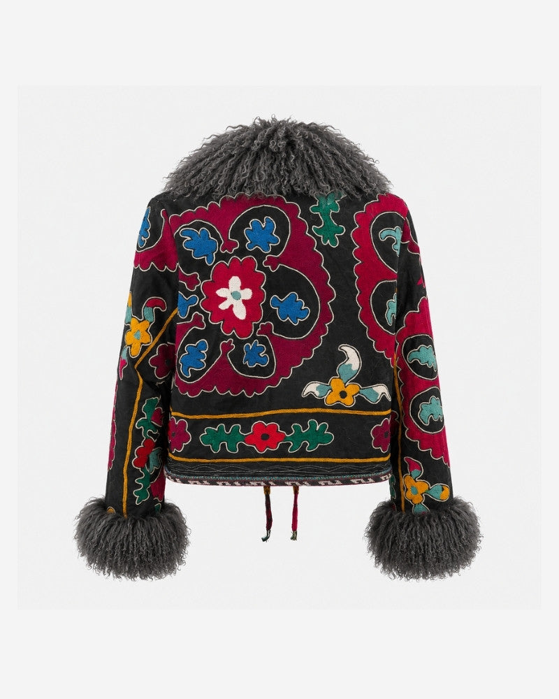 The Afghan Coat Martina No. 5 by Lunaré – back view showing the hand-embroidered red, blue and multicolor suzani-style floral pattern and grey Tibetan lamb fur collar and cuffs.