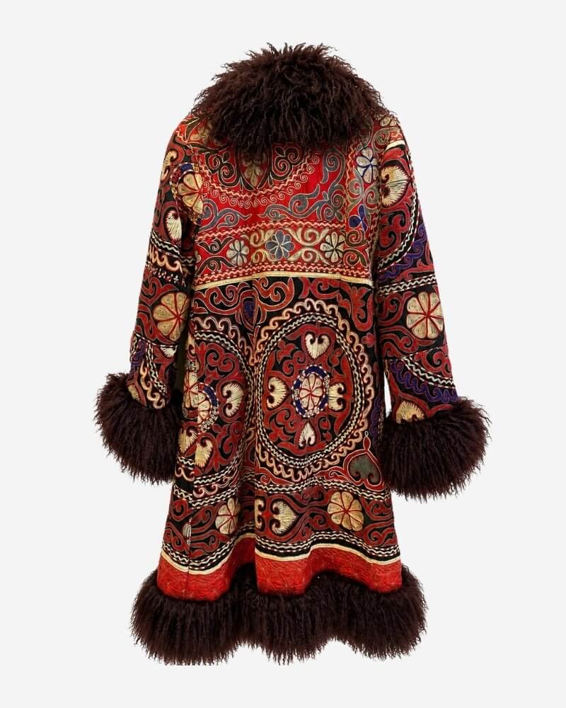 The Afghan Coat Ragna No. 4 by Lunaré – back view showing the intricate red, black, cream and violet hand-embroidered paisley medallion pattern with burgundy shearling collar and cuffs.
