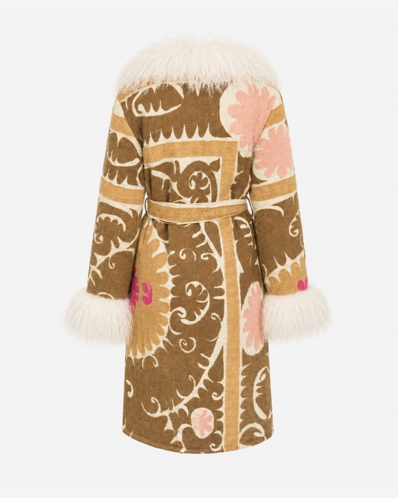 The Afghan Coat Silje by Lunaré – back view, long mid-calf coat in tan with cream hand-embroidered swirl pattern, pink floral accents, and cream shaggy shearling collar and cuffs.