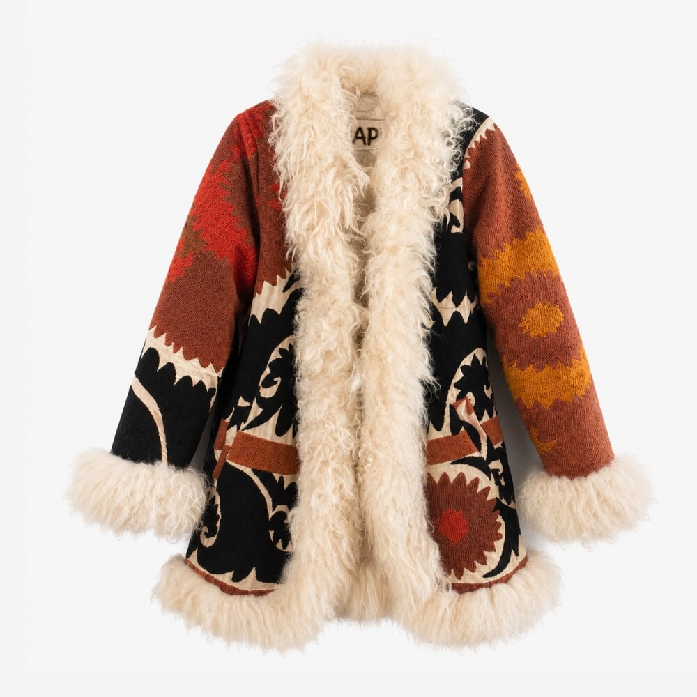 Statement Afghan coat with bold embroidered patterns and an oversized shaggy fur trim, from the Lunaré Coats collection.