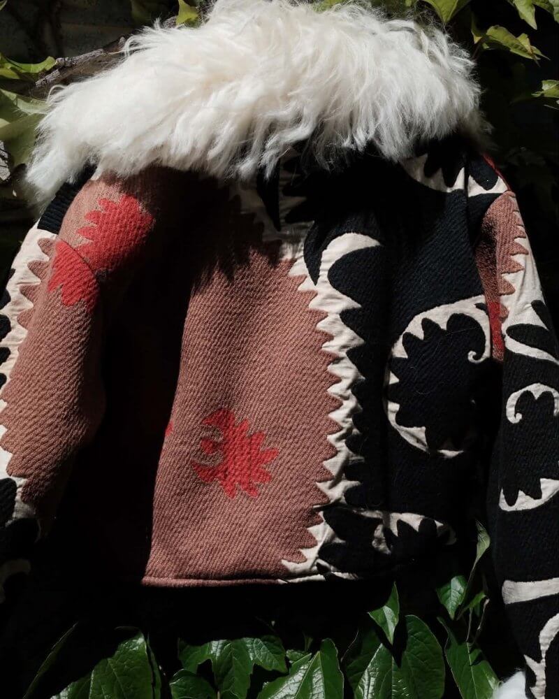 The Afghan Coat Coco No. 7 by Lunaré – back detail, black and pink patterned coat with white shaggy shearling collar.