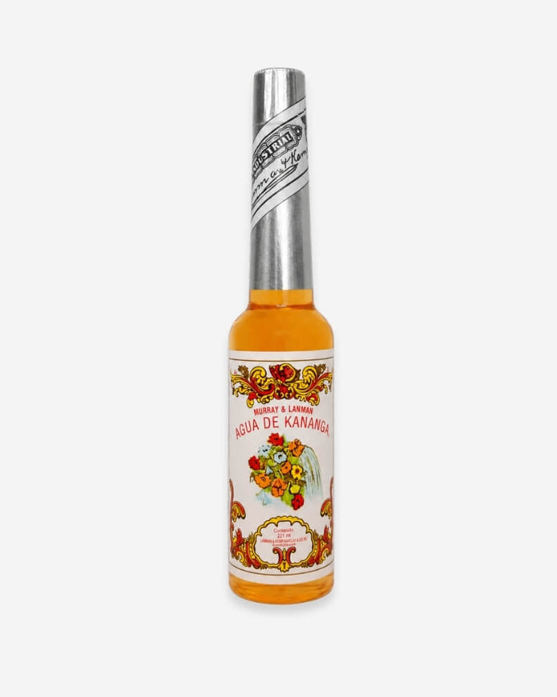 Murray & Lanman Agua de Kananga bottle, golden liquid with an ornate, traditional floral label.