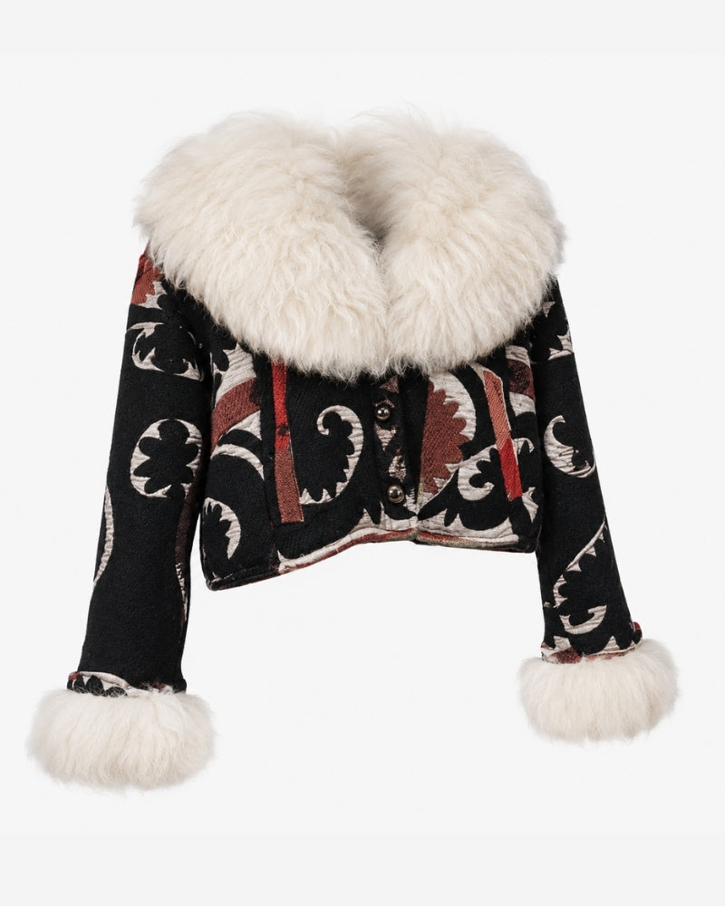 The Afghan Coat Coco No. 4 by Lunaré – front view, black hand-embroidered jacket with ivory swirl leaf motifs and rust accent stripes, finished with a cream shaggy shearling collar and cuffs.
