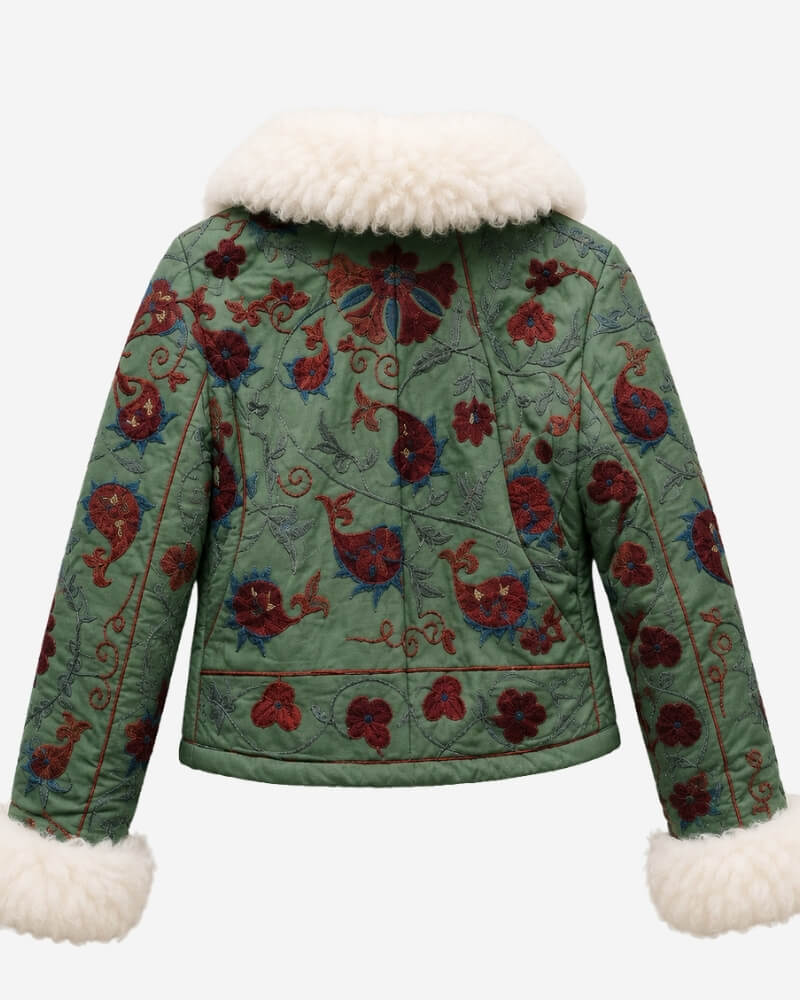 The Afghan Coat Coco No. 2 by Lunaré – back view showing dense burgundy and blue hand-embroidered floral vine pattern on the sage-green jacket with cream shaggy shearling collar and cuffs.