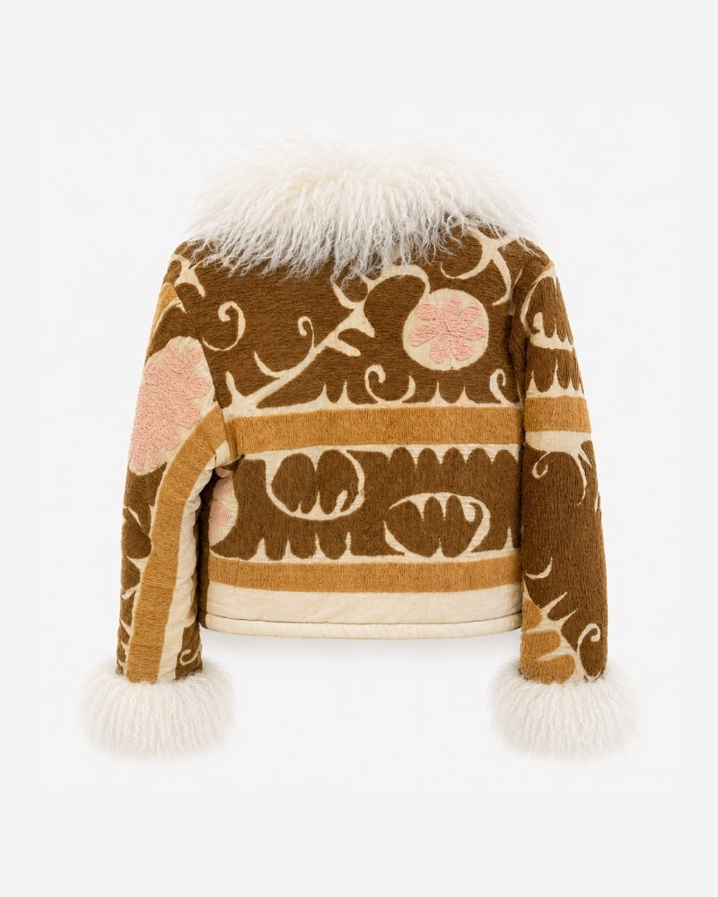 Coco Afghan Jacket No. 6, back view, in brown with a striped scroll and leaf pattern, pink flower medallions on the shoulders, and a cream shearling collar and cuffs.