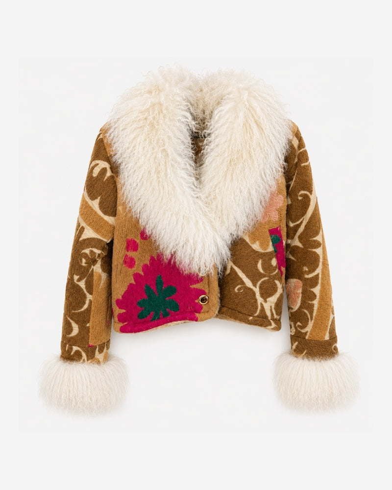 Coco Afghan Jacket No. 6, front view, in brown with a cream vine pattern, a large magenta and green flower embroidery at the chest, and a cream shearling collar and cuffs.