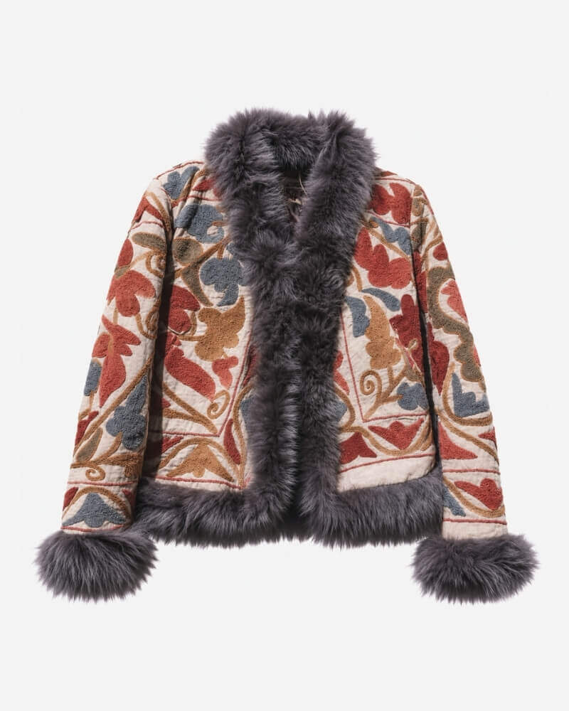 The Afghan Coat Eliza by Lunaré – front view, cream jacket with rust, blue-grey, and tan hand-embroidered floral and vine motifs and dark grey shaggy fur trim.