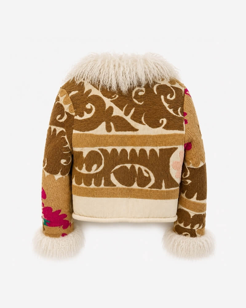 Martina Afghan Jacket No. 10, back view, in tan with a bold striped scroll pattern, pink floral embroidery on the sleeves, and a cream shearling collar and cuffs.