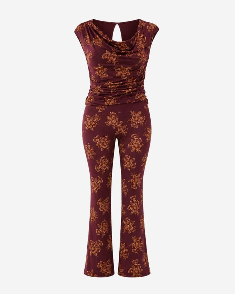 Nube set – Floral by Lunaré – draped cowl-neck cap-sleeve top and flared trousers in burgundy with orange floral print.