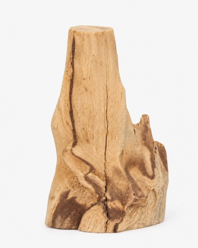 Hand-picked Palo Santo wood piece with a natural, sculptural shape and rich wood grain.