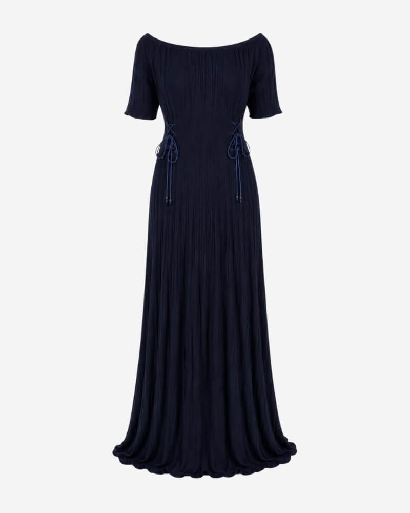 Rose Dress in navy ribbed knit, short sleeves with adjustable side lacing and a fluted, high-slit hem.