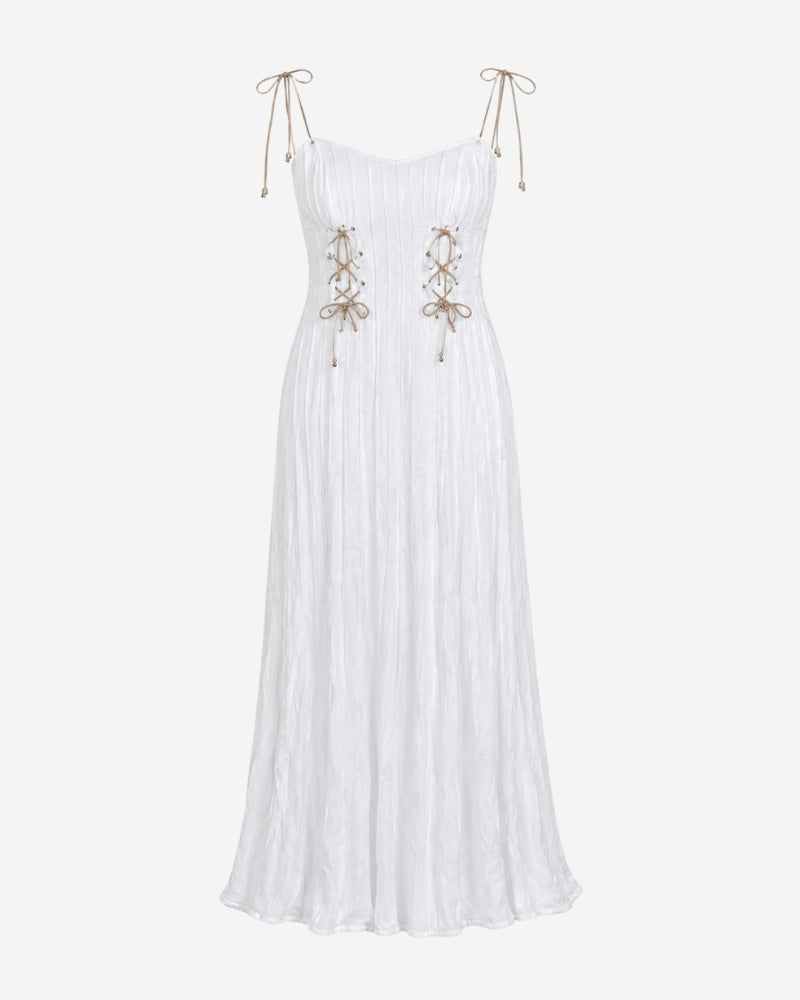 Rose Dress in white, strap version with tie-shoulder straps and adjustable front lacing with pearl detail, flowing floor-length silhouette.
