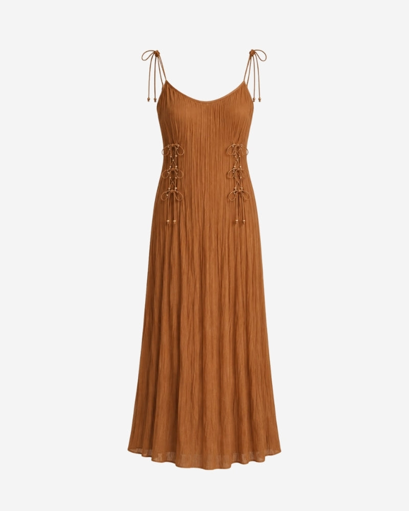 Rose Dress in rust camel, strap version with tie-shoulder straps and adjustable front lacing with pearl detail.