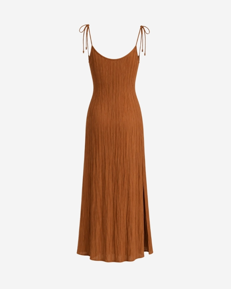 Rose Dress in dark camel, hanging view showing the flowing silhouette and thin tie-shoulder straps.