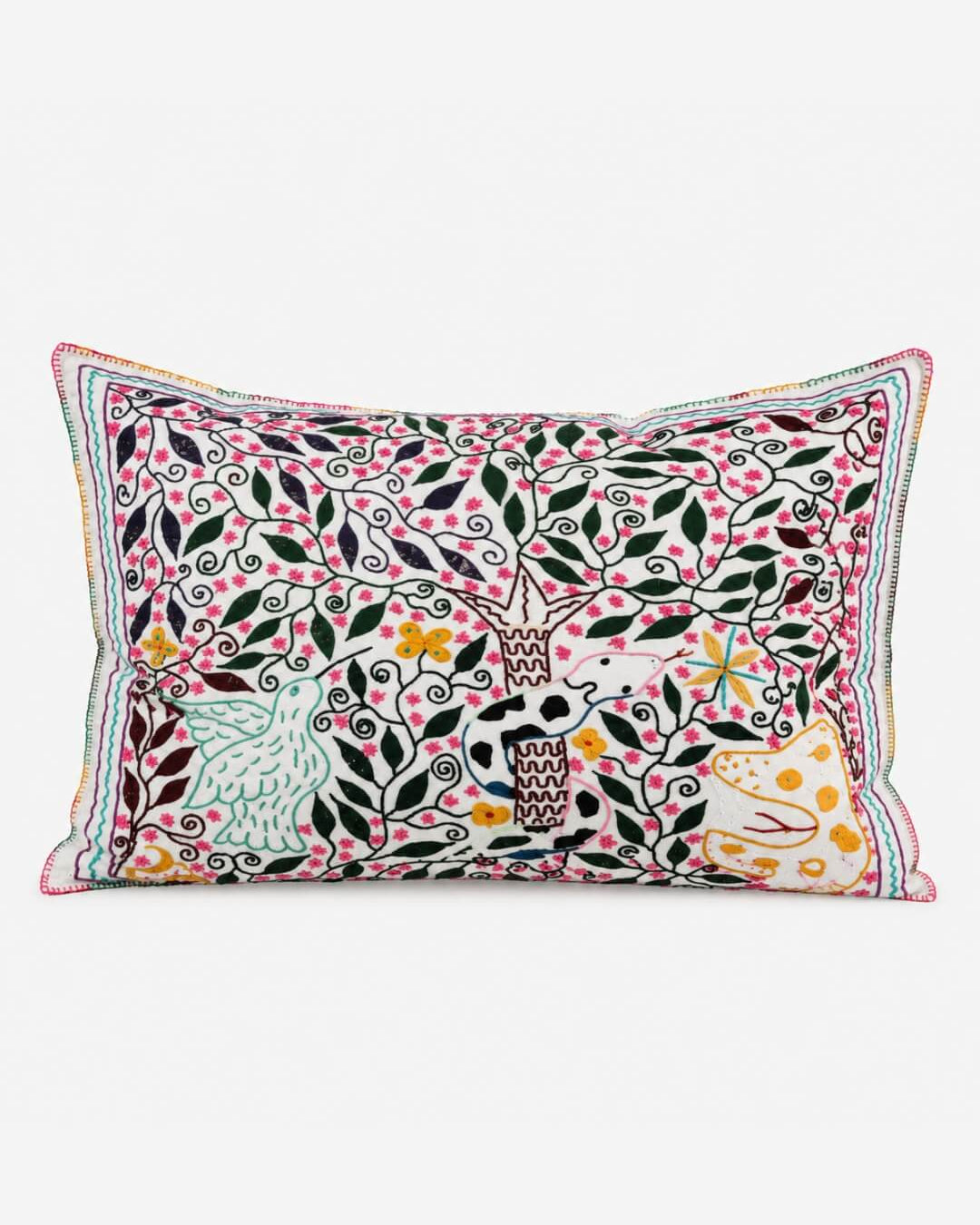 Hand-Embroidered Shipibo Cushion No. 5 in cream with a botanical vine pattern and small bird and animal motifs.