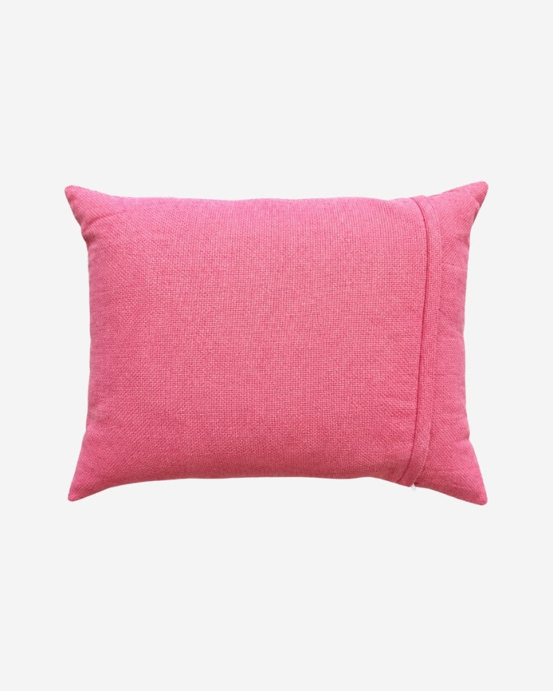 Hand-Embroidered Shipibo Cushion No. 11 by Lunaré – back view, solid pink textured cotton cover.