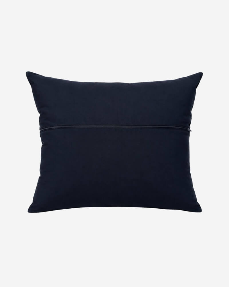 Hand-Embroidered Shipibo Cushion No. 2 by Lunaré – back view, solid navy cotton cover.