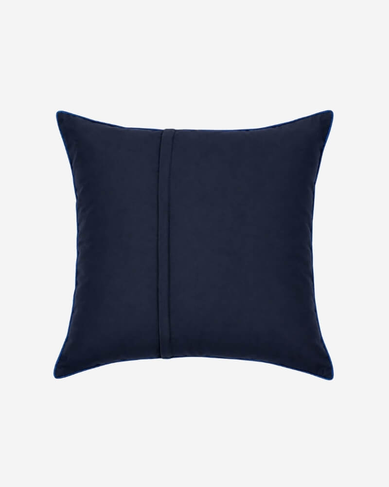 Hand-Embroidered Shipibo Cushion No. 4 by Lunaré – back view, solid navy cotton cover.