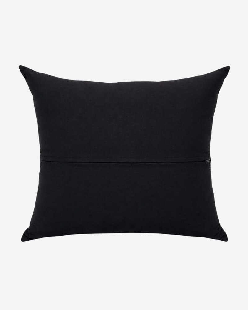Hand-Embroidered Shipibo Cushion No. 5 by Lunaré – back view, solid black cotton cover.