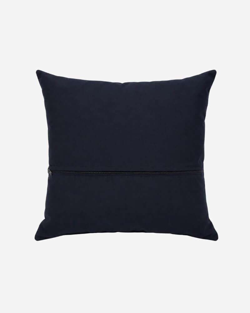 Hand-Embroidered Shipibo Cushion No. 6 by Lunaré – back view, solid navy cotton cover.