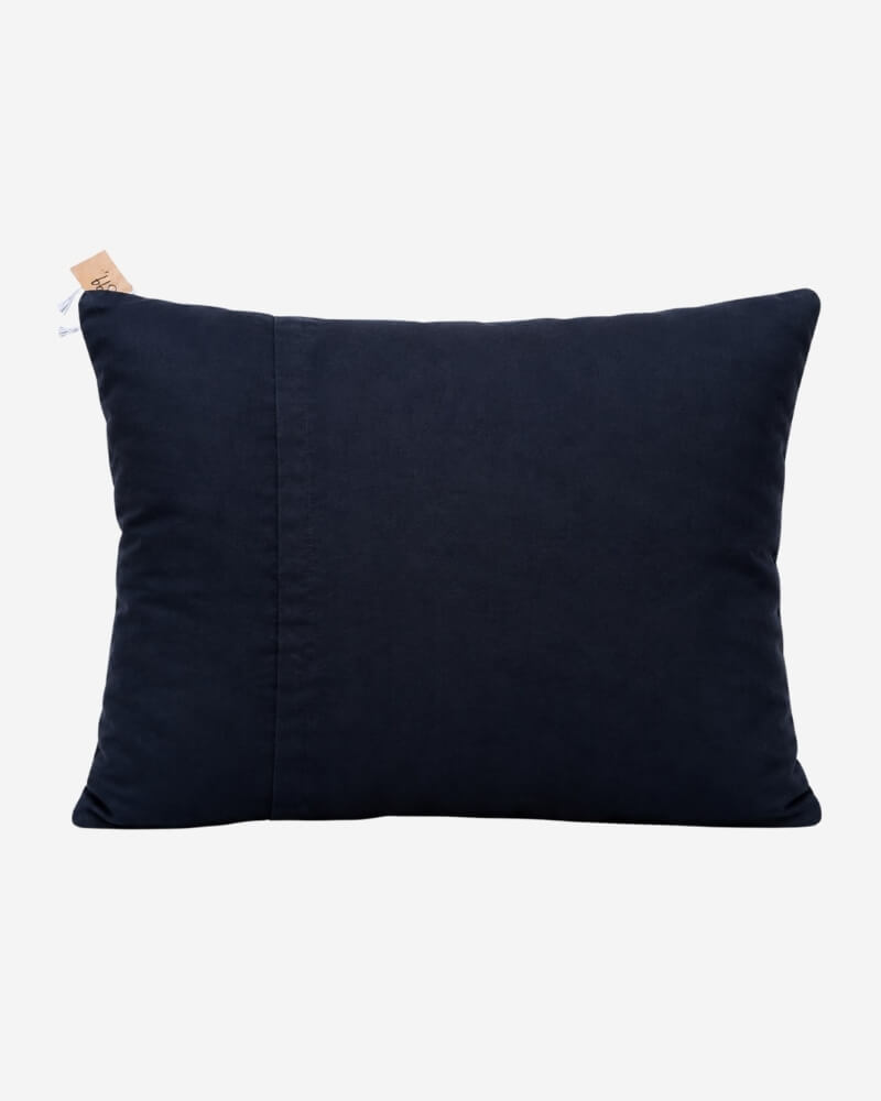 Hand-Embroidered Shipibo Cushion No. 7 by Lunaré – back view, solid navy cotton cover.
