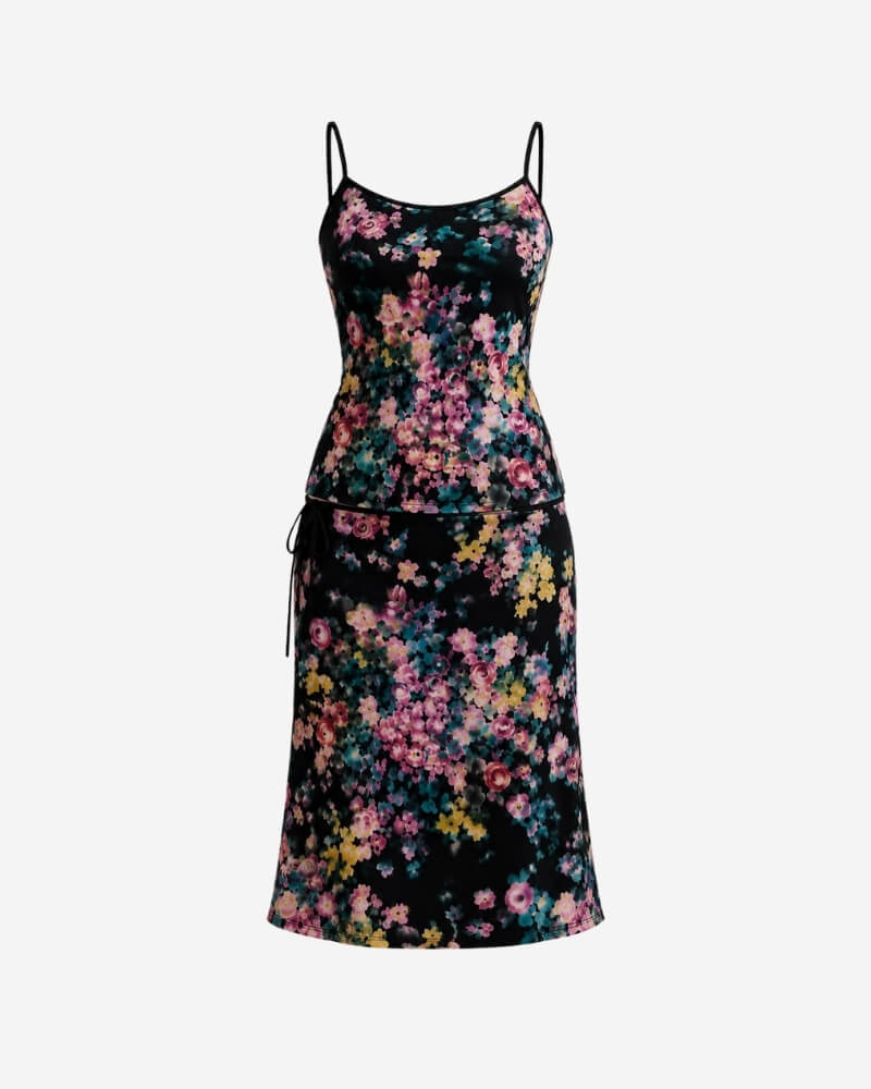 The Solita set by Lunaré – fitted camisole top and matching skirt, both in black with pink, yellow, and teal floral print.