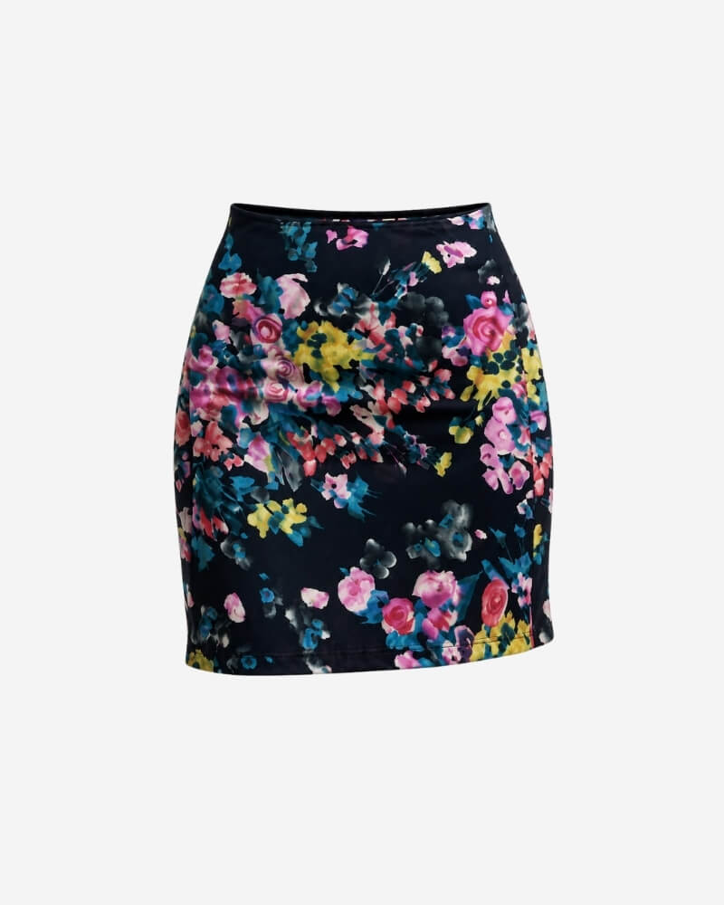 Solita Skirt – Short by Lunaré – flat lay, navy A-line skirt with pink, yellow and teal floral print.