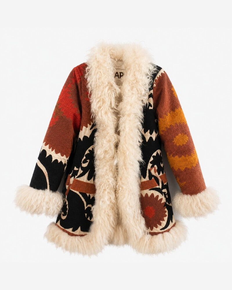 The Afghan Coat Jasmia No. 2 by Lunaré – front view, open cardigan-style coat with red, black, and orange geometric embroidered patchwork panels and cream shaggy shearling trim.