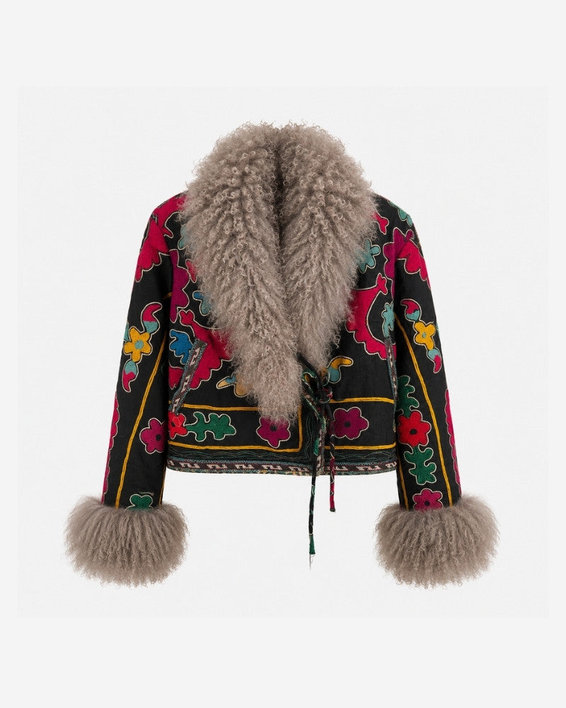 The Afghan Coat Martina No. 6 by Lunaré – front view, black jacket with hand-embroidered multicolor floral pattern and a taupe Tibetan lamb fur collar and cuffs.