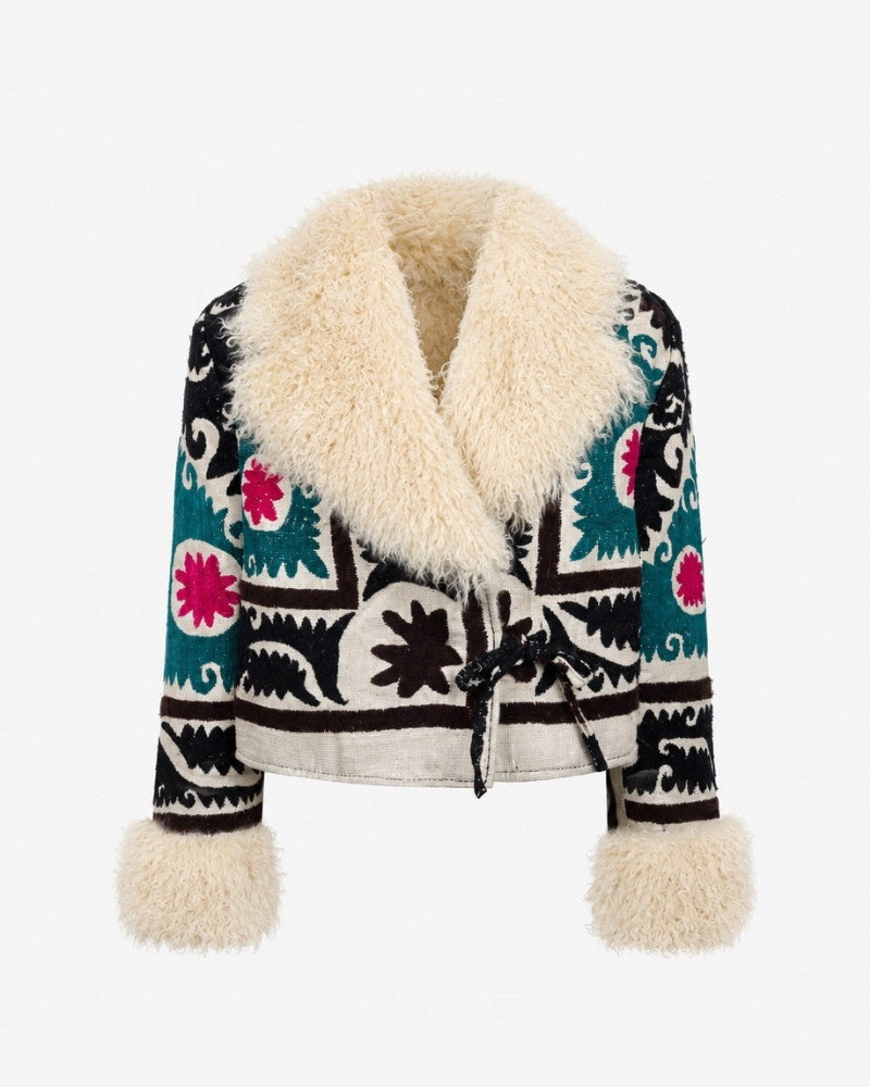 The Afghan Coat Martina No. 1 by Lunaré – black jacket with hand-embroidered teal and pink florals, cream shearling collar and cuffs.