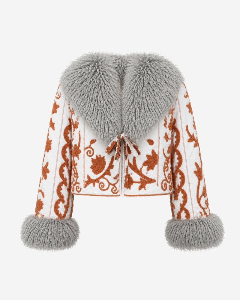 The Afghan Coat Martina No. 4 by Lunaré – front view, cream jacket with hand-embroidered rust-orange florals and a light grey Tibetan lamb fur collar and cuffs.
