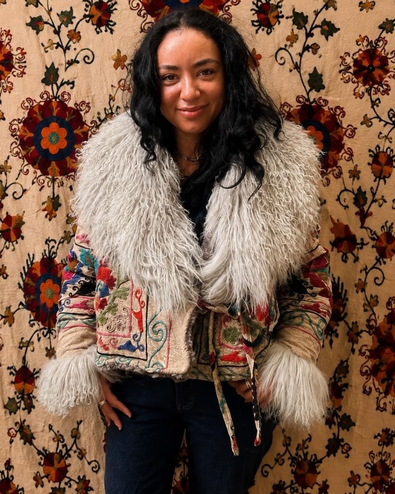 The Afghan Coat Martina No. 9 by Lunaré – front view on model, multicolor floral embroidered coat with cream shaggy shearling collar.
