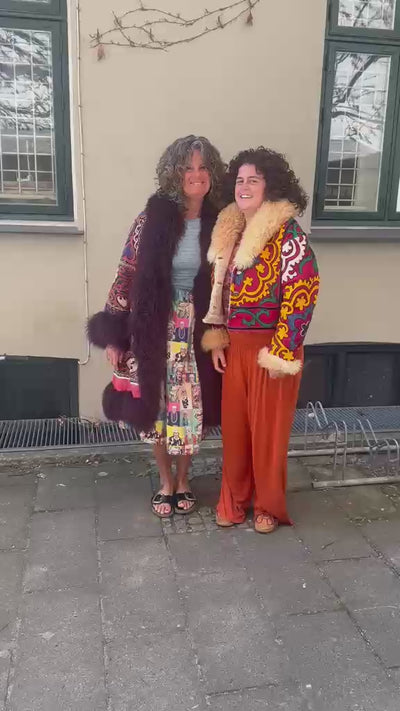 The Afghan Coat Ragna and The Afghan Coat Coco by Lunaré – product video, lifestyle try-on footage showing pattern and shaggy shearling detail.